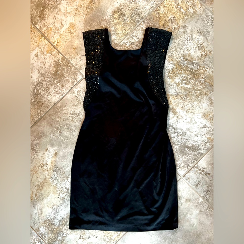 Black dress with detail on shoulders and back